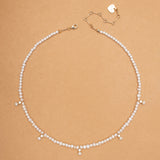 WHITE PEARL STRING CHARM NECKLACE
