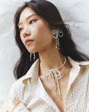 WHITE PEARL BOW STATEMENT EARRINGS