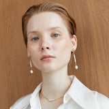 ELONGATED WHITE PEEARL DROP LONG EARRINGS