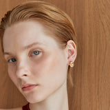 SMALL WHITE PEARL CRADLE STUD EARRINGS