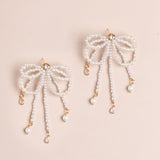 WHITE PEARL BOW STATEMENT EARRINGS