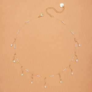 WHITE PEARL SWIRL CHARM NECKLACE