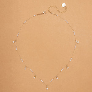 WHITE PEARL FISH CHARM NECKLACE