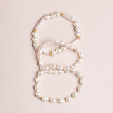 WHITE PEARL GOLD CHARM LAYER BRACELET